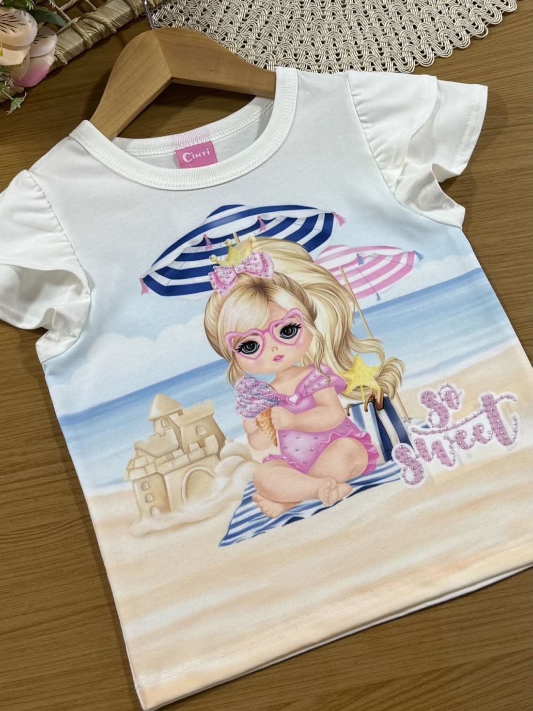Blusa Infantil Cinti Verão Branca Menina na Praia com Strass