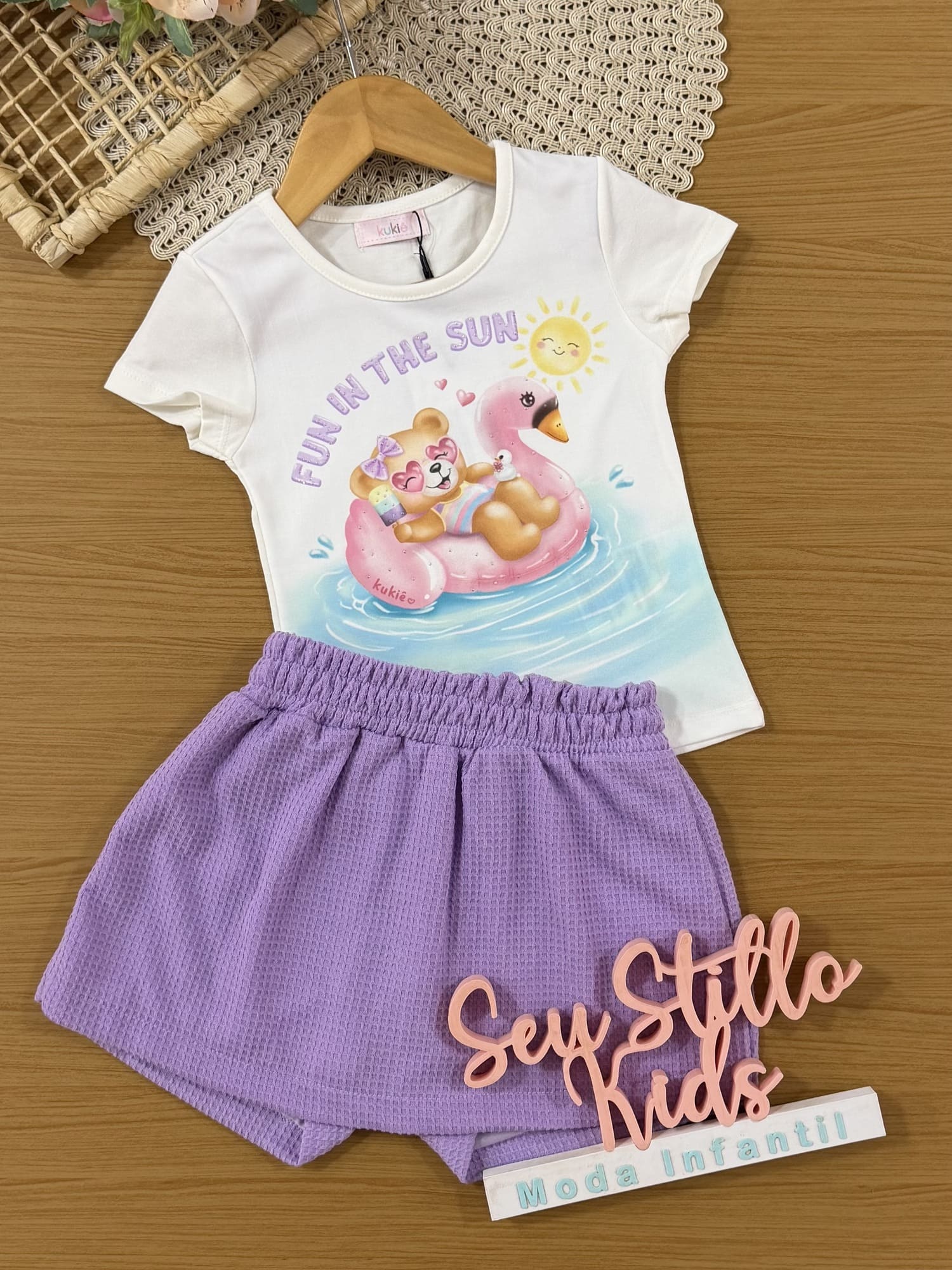 Conjunto Infantil Kukiê com Shorts Lilás e Blusa Ursinha na Praia