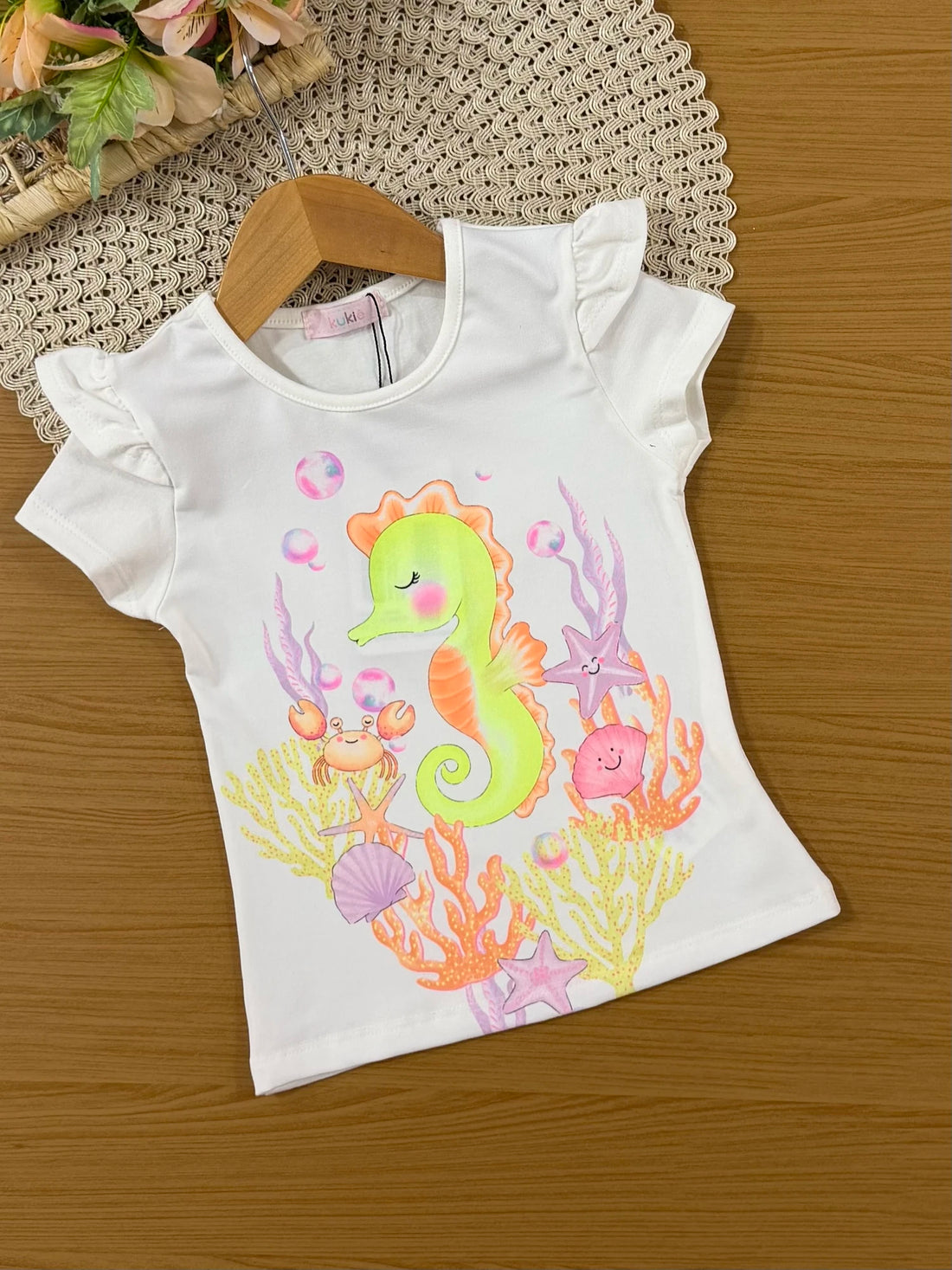 Conjunto Infantil Kukiê com Shorts Amarelo e Blusa Cavalo Marinho