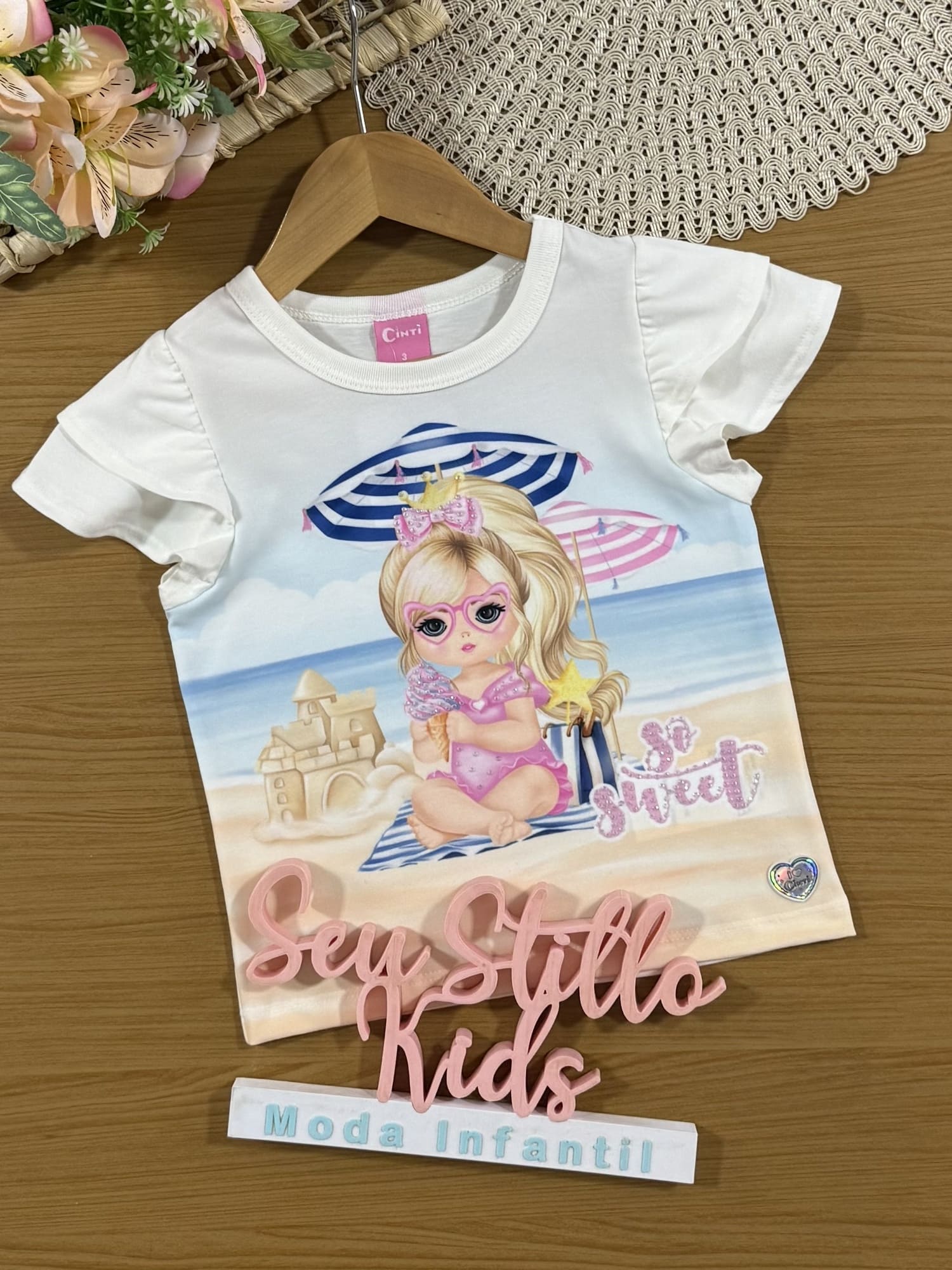 Blusa Infantil Cinti Verão Branca Menina na Praia com Strass