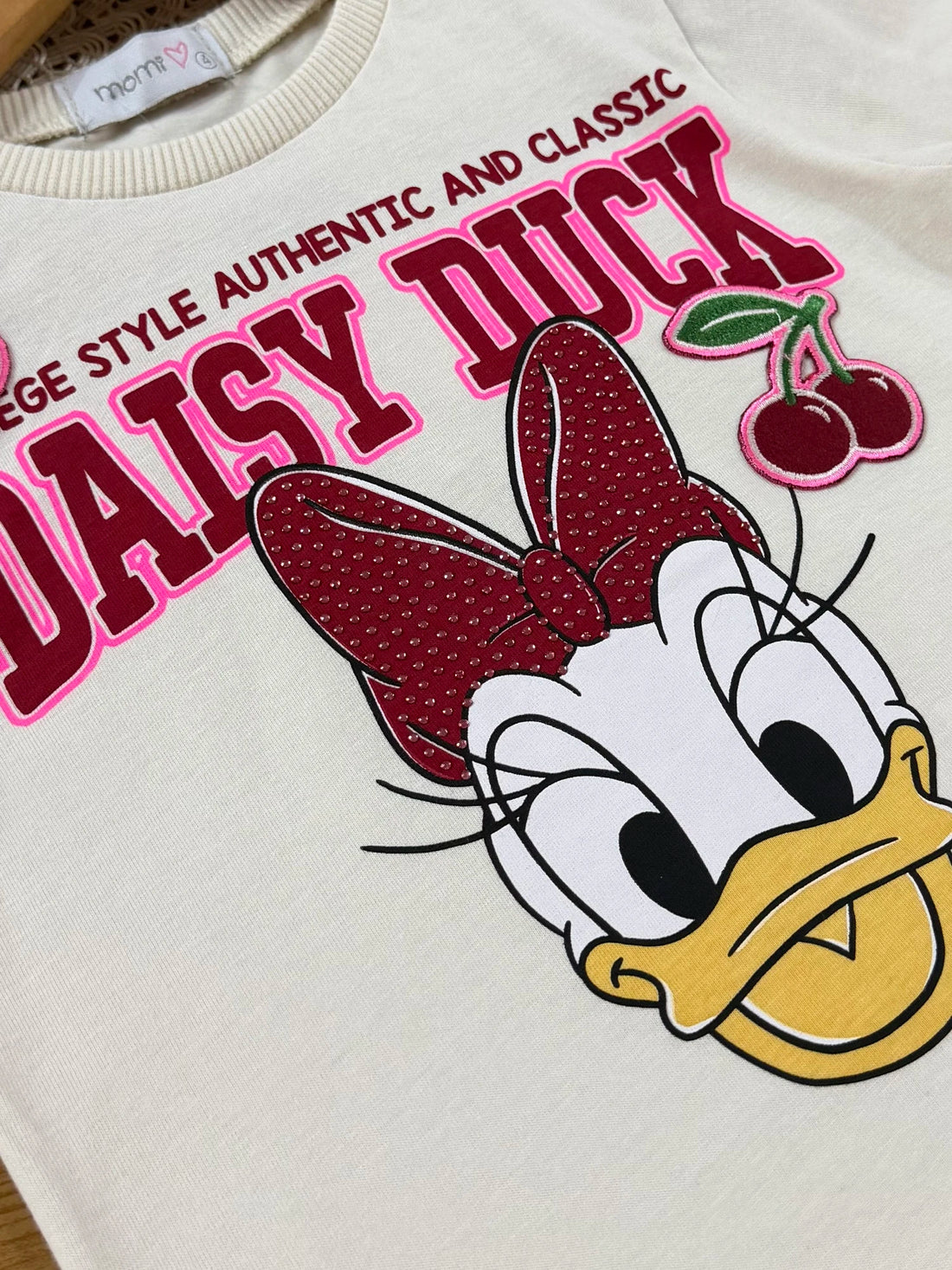 Blusa Infantil Momi Inverno Manga Curta Bege Daisy Duck Cerejinha Disney