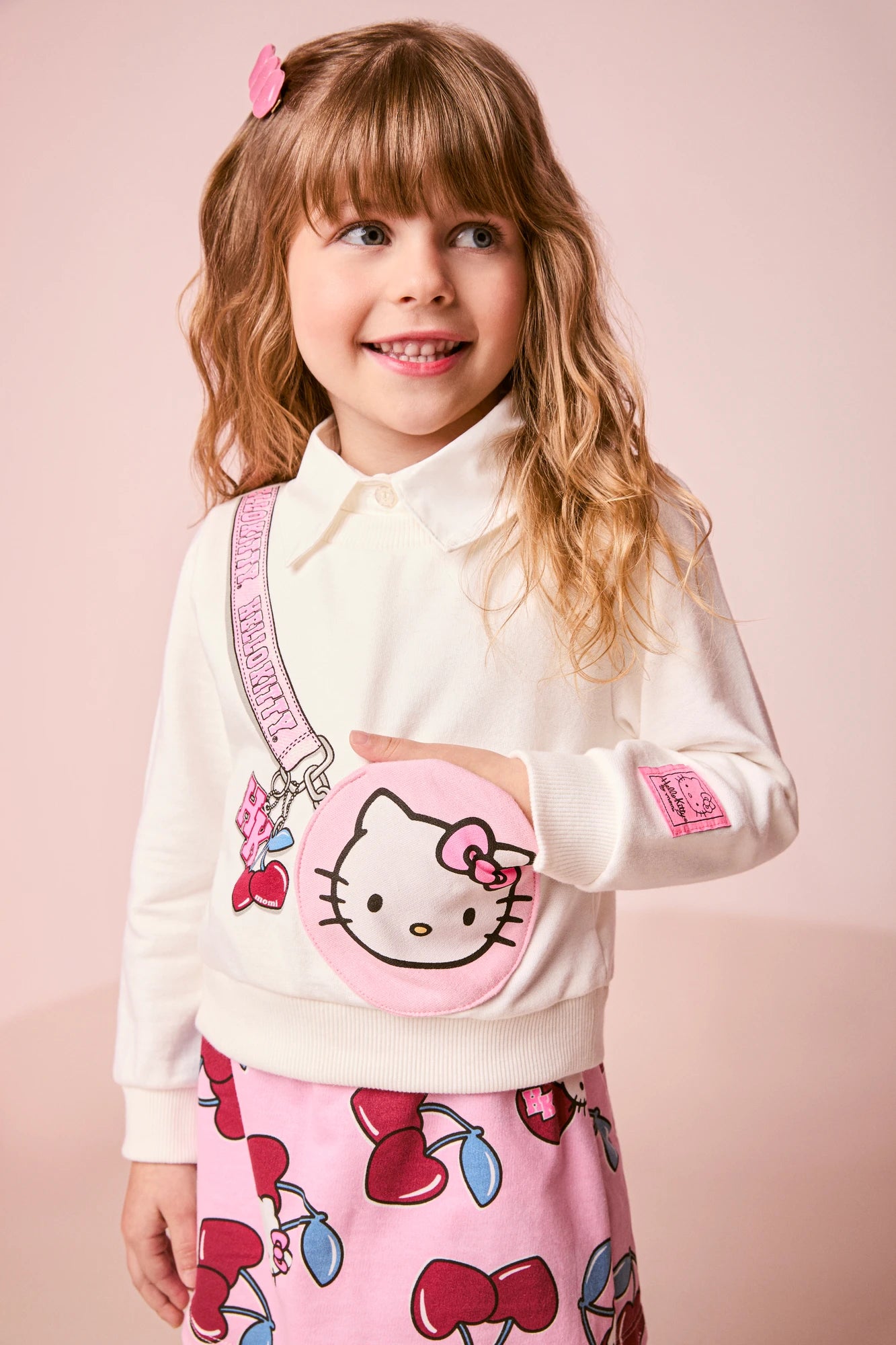 Conjunto Infantil Momi Inverno com Shorts Saia Rosa e Moletom sem Flanela Bolsinha Hello Kitty 3D