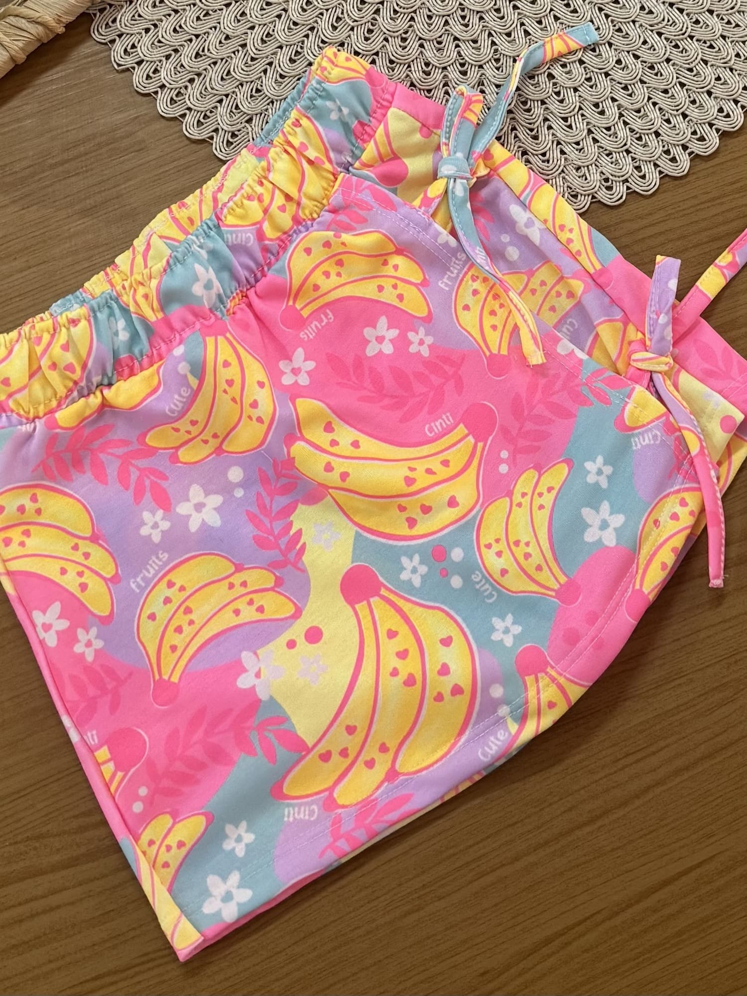 Conjunto Infantil Cinti Verão com Shorts Saia Colorido e Blusa Branca Frutinhas