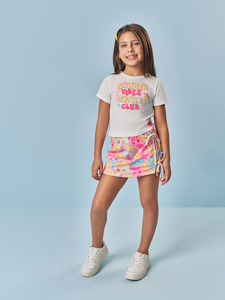 Conjunto Infantil Cinti Verão com Shorts Saia Colorido e Blusa Branca Frutinhas