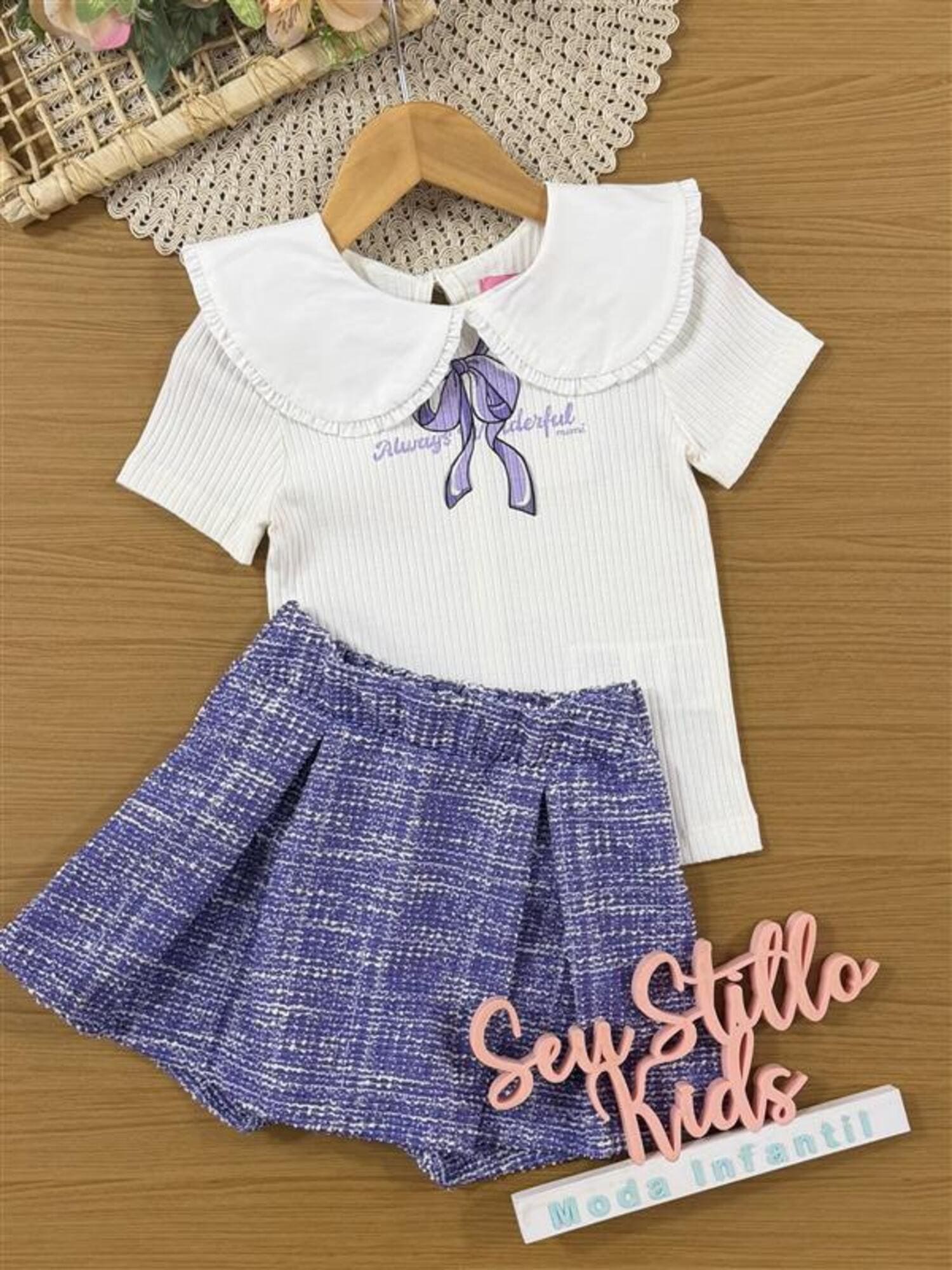 Conjunto Infantil Momi Inverno com Shorts Saia Lilás e Blusa Manga Curta Lacinho