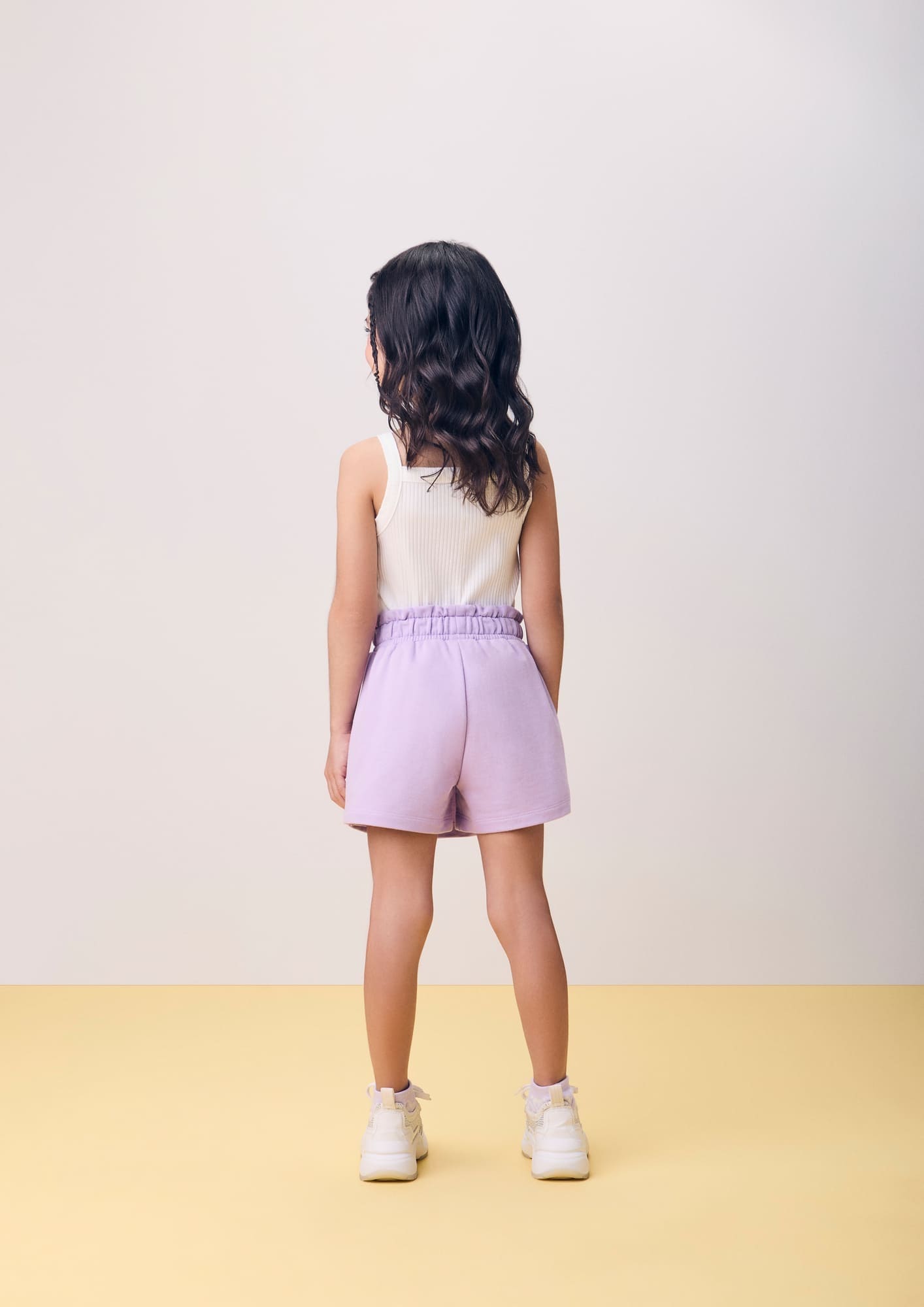 Conjunto Infantil Momi Verão com Shorts Saia Lilás e Regata Branca Lacinho Borboleta